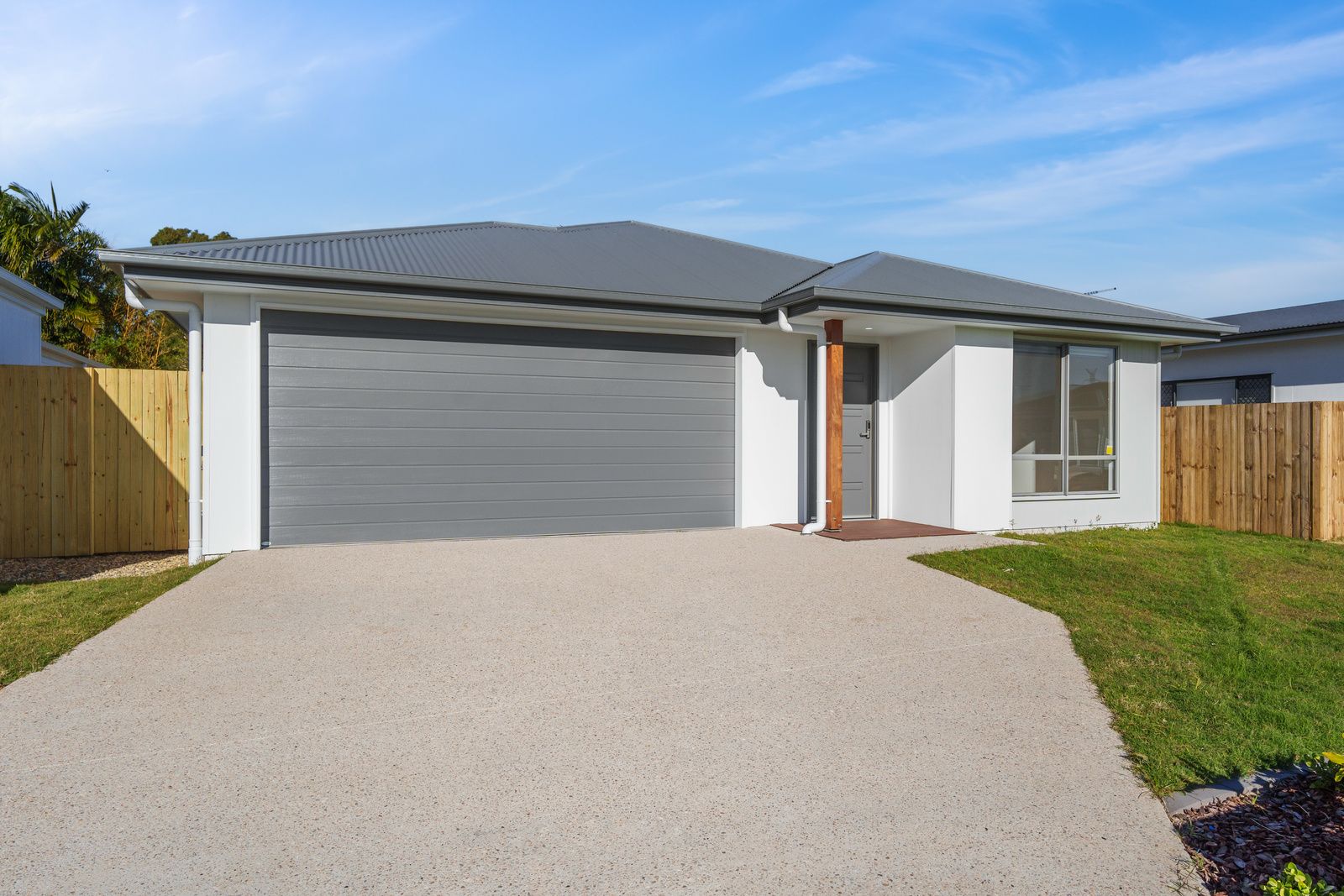 Front exterior with double garage of the SIL & SDA home in Caboolture
